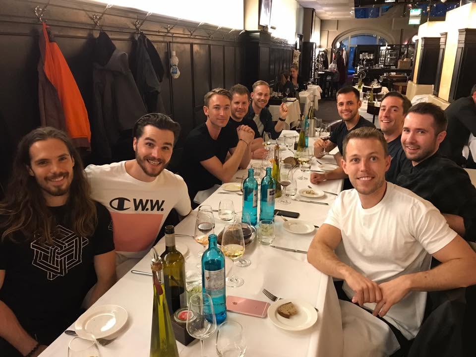 Faust Whale sharing a restaurant table with a group of friends in Berlin